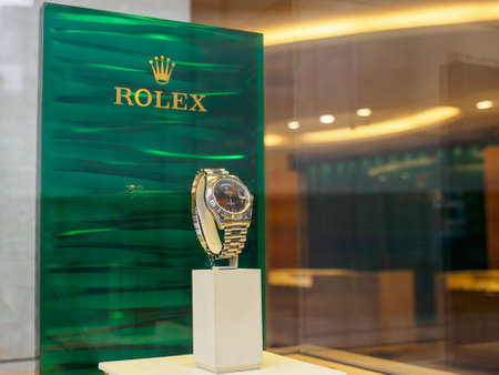 LONDON, ENGLAND - MARCH 8, 2019: Rolex Oyster Perpetual Day-Date white gold timepiece on window display at a authorized dealer near Knightsbridge. Travel and Swiss luxury watch industry.のeditorial素材