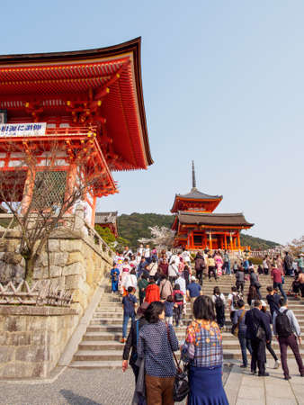 KYOTO, JAPAN - MARCH 29, 2018: Wide vertical view of the stairs at the Niomon Deva Gate and Three-Story Pagoda on a sunny afternoon. Kiyomizu-Dera, Higashiyama. Travel and tourism.のeditorial素材