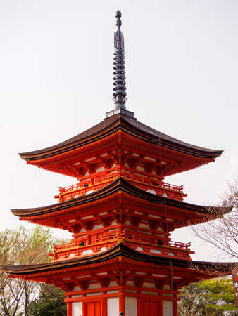 KYOTO, JAPAN - MARCH 29, 2018: Wide vertical view of the famous vermillion Koyasu Pagoda on a sunny afternoon Kiyomizu-Dera Temple, Higashiyama. Travel and tourism.のeditorial素材