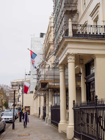 LONDON, ENGLAND - MARCH 8, 2019: Wide vertical of the Serbian and Bahrain embassies under repair and rennovation. Royal Borough of Kensington and Chealsea, Knightsbridhge. Travel and politics.のeditorial素材