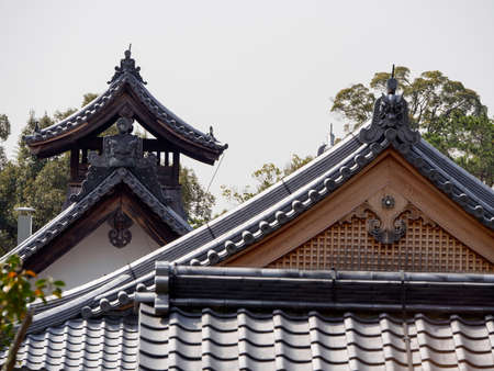 KYOTO, JAPAN - APRIL 2, 2018: Wide angle view of the intricate carvings on the rooftop gables of the Fudo Myo-o Hall near Kinkakuji pavilion. Travel and tourism.のeditorial素材
