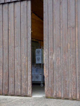 NANSTALLON, ENGLAND - MARCH 4, 2019: Wide vertical view of boxes of wine ready for shipping at a warehouse at the Camel Valley vineyard. Travel and British artisanal winemaking industry.のeditorial素材