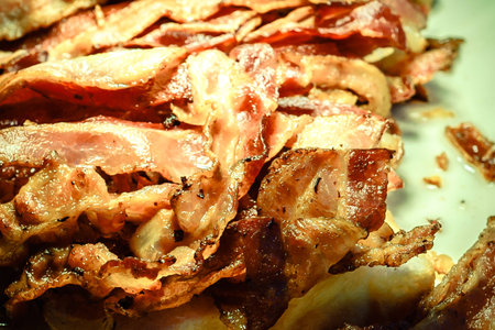 Bacon is a delicious breakfast but we should eat not much to prevent having fat in body.の写真素材