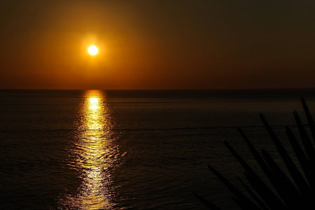 A place in Thailand that tourist favor to visit is Laem Phromthep in Phuket to see a beautiful sunset scene.の写真素材