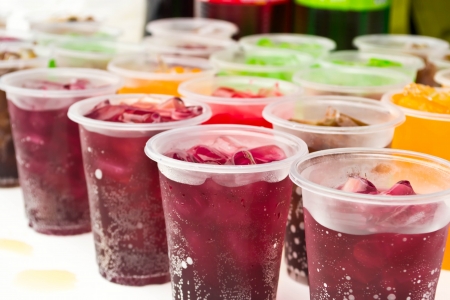 Soft drinks in plastic cupsの写真素材