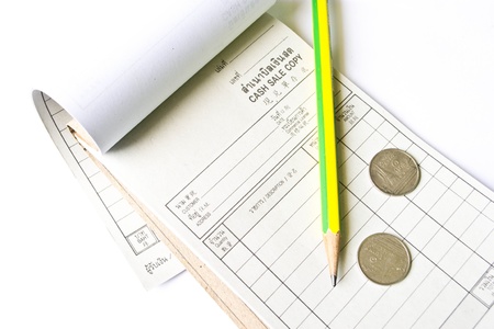 Receipt, pencil and Coins on a white background 