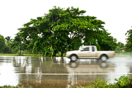 Car on wet roadsの写真素材