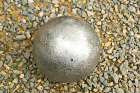 Petanque ball on stone background