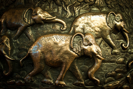 Silver elephant and silver frame handmade on white backgroundの写真素材