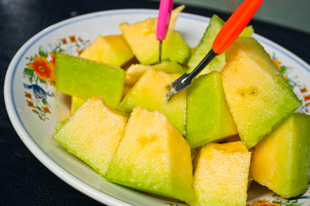cantaloupe on a plate on the table