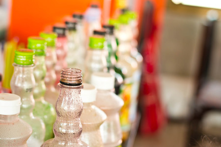 Sweet water bottles lined up on the shopの写真素材
