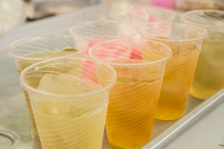 Soft drinks in plastic cups with Ice coolの写真素材