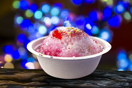 A Bowl with red ice set on a abstract backgroundの写真素材