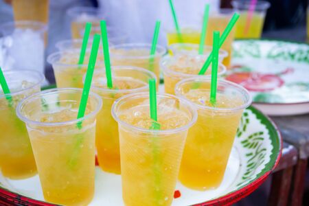 Colorful soft drink in plastic cupの写真素材