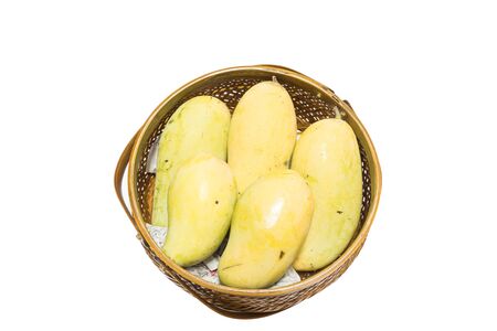 Fresh mango in basket isolated on white backgroundの写真素材