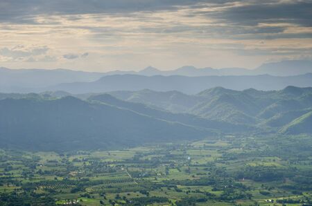Fantastic layer of mountain and field with light effectの写真素材