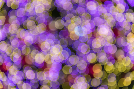 Abstract background of purple and yellow circles bokehの写真素材