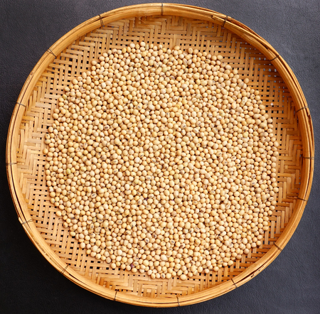 Soy beans with bamboo texture background.の写真素材