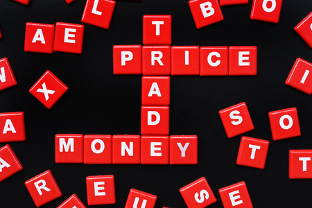The words PRICE, TRADE and MONEY spelled using letter in the style of a crosswordの写真素材