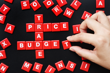 The words PRICE, TRADE and MONEY spelled using letter in the style of a crosswordの写真素材