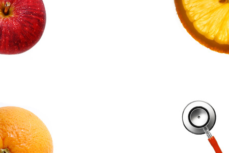Stethoscope and fresh fruit isolate on white backgroundの写真素材
