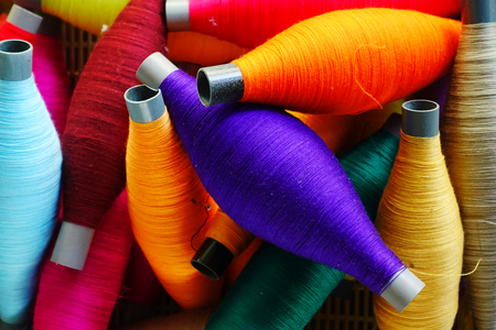 Colorful thread spools used in fabric and textile industryの写真素材