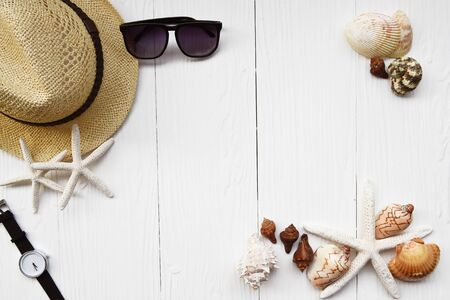 Summer hat and sunglasses with accessories on white background