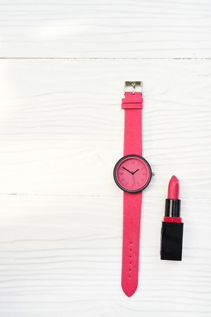 watch and lipstick on white backgroundの写真素材