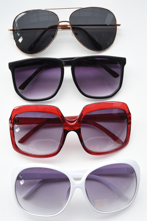 Modern fashionable sunglasses isolated on white backgroundの写真素材