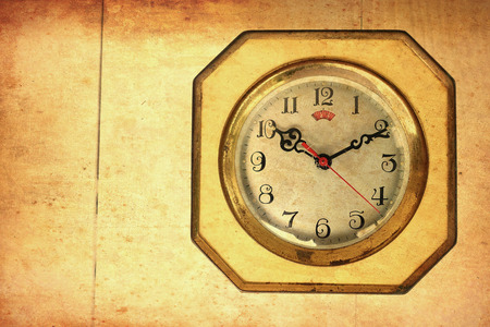 Closeup antique old style clock with sunlight vintage colorの写真素材