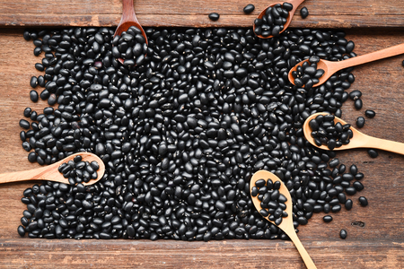 Black beans on wooden backgroundの写真素材