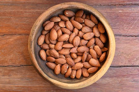 close up of almonds on wooden backgroundの写真素材
