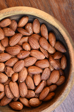 close up of almonds on wooden backgroundの写真素材