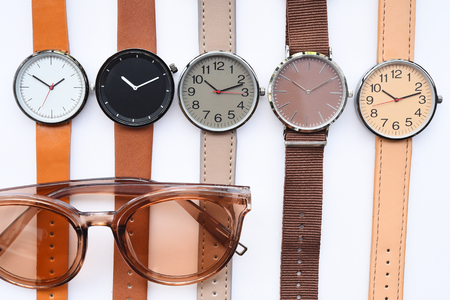 Modern fashionable sunglasses and set of multicolored wristwatch isolated on white backgroundの写真素材