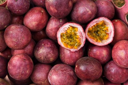 close up of fresh purple passion fruits harvest from farmの写真素材