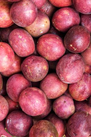 close up of fresh purple passion fruits harvest from farmの写真素材