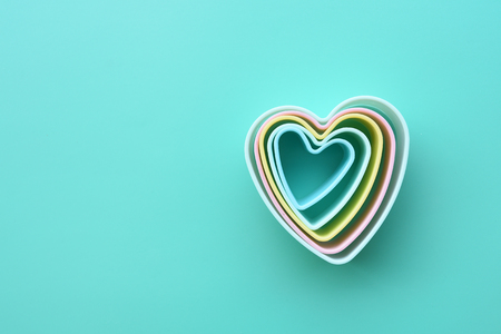 Many heart shaped of dessert plastic mold in multi color for background