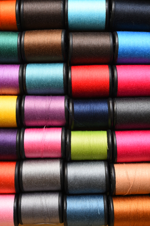 close up of colorful thread spools for backgroundの写真素材