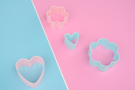 Close up of heart shaped and flower shape of dessert plastic mold for backgroundの写真素材