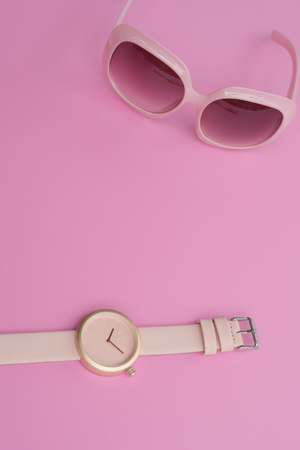 Set of multicolored wristwatches with fashionable sunglasses for backgroundの写真素材