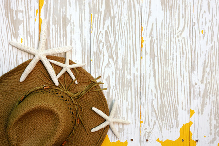 summer hat and starfish on white backgroundの写真素材
