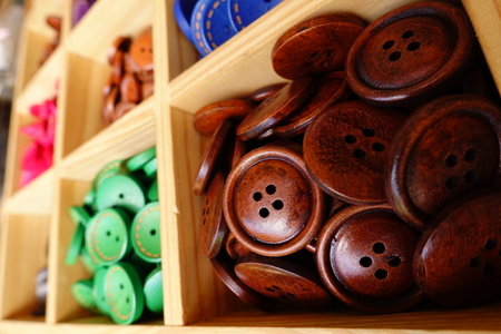 close up of beautiful colored wooden buttons for background
