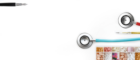 different medication and mercury thermometers with stethoscope isolated on white backgroundの写真素材
