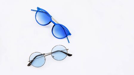 Modern fashionable sunglasses isolated on white backgroundの写真素材