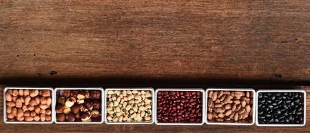collection of different legumes on wooden background