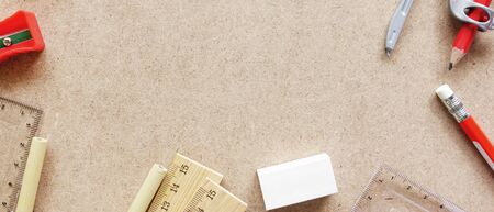 top view of stationary on wooden background