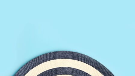 close up of summer straw hat on blue backgroundの写真素材