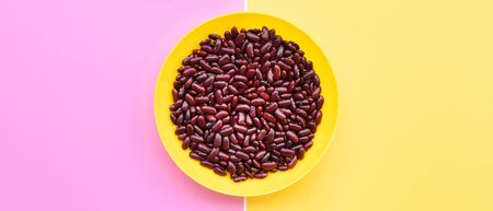 close up of red kidney beans on yellow plate