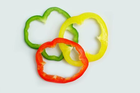 close up of slices of bell pepper isolated on white backgroundの写真素材
