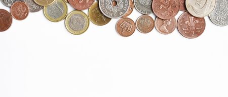 close up of coins isolated on white backgroundの写真素材